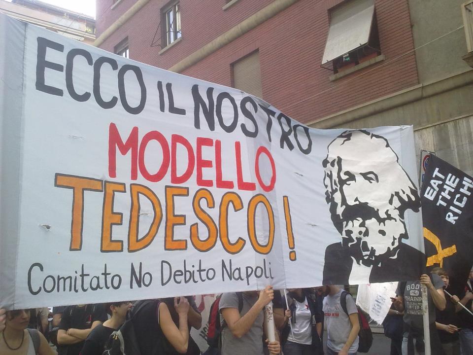 Uno degli striscioni della manifestazione tenutasi a Milano questa mattina Occupy Piazza Affari.